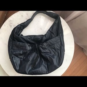 Tod’s black shoulder bag with the iconic rubber pebbles